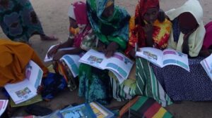 girls with school books listening to radio