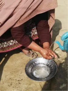 Woman washing hands, Pakistan