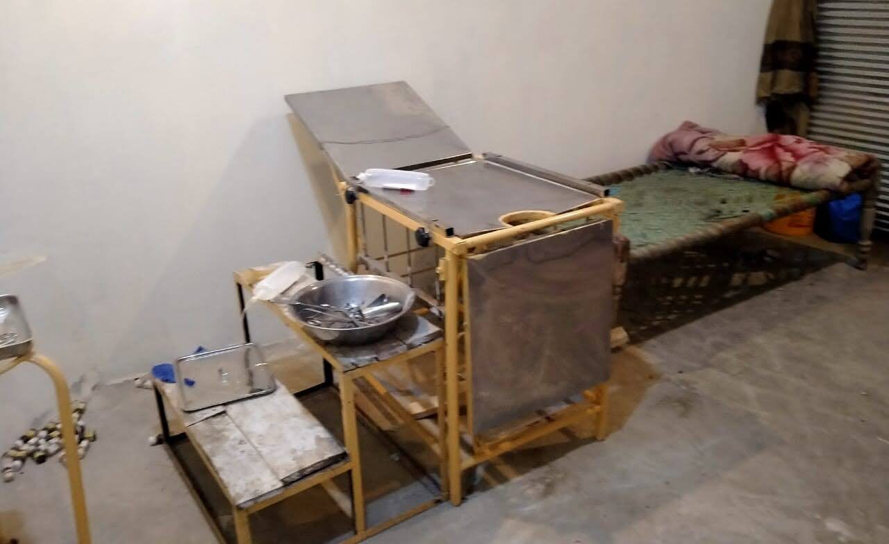 Infant treatment table, bed and utensils in basic maternity clinic
