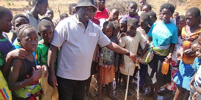 Milden Choongo at water tap