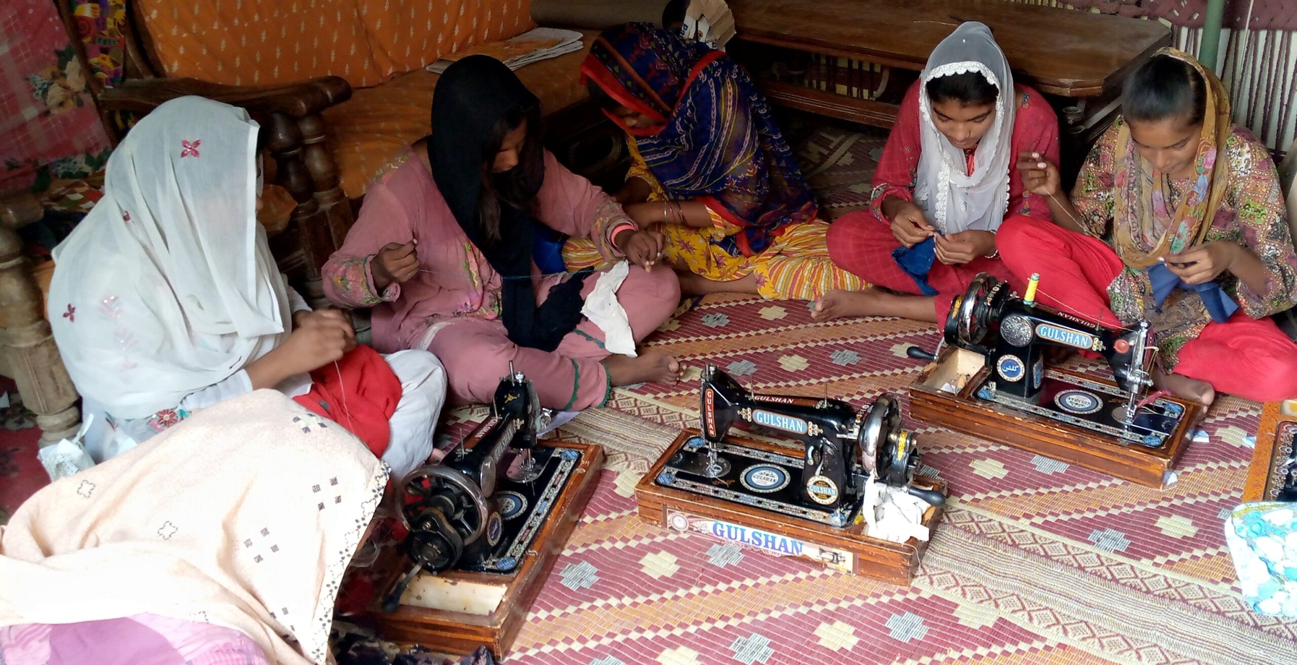 Women learning to sew