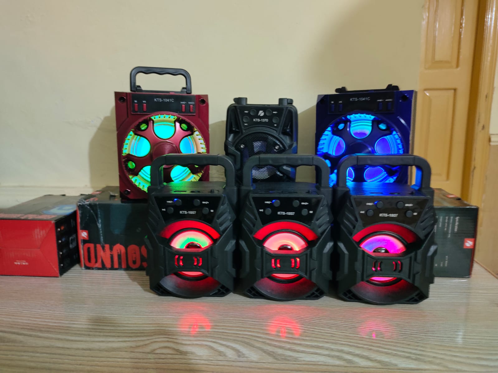 pile of speakerboxes with coloured lights