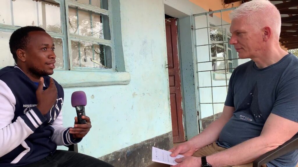 a man being interviewed by another man