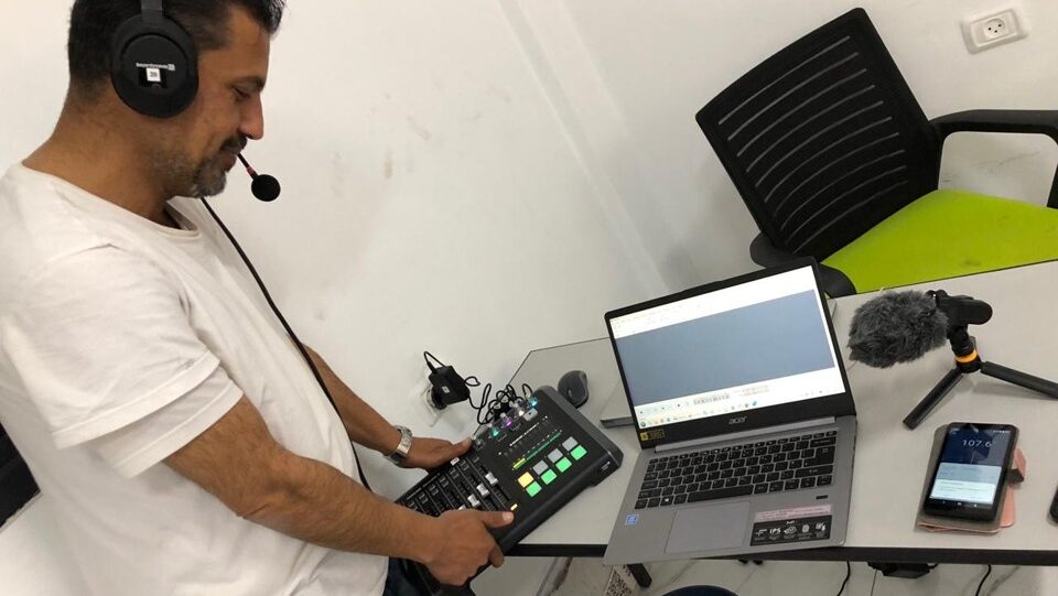 A man holding a mixing console