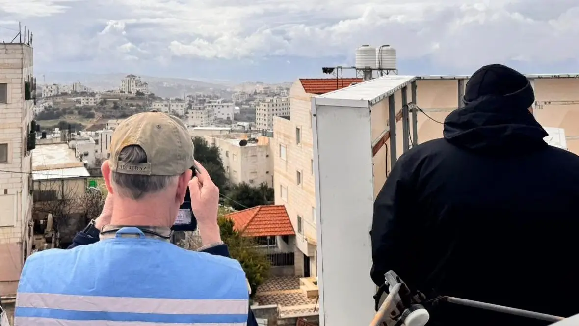 Two men on a rooftop