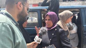 Man and woman talk about Gaza transportation