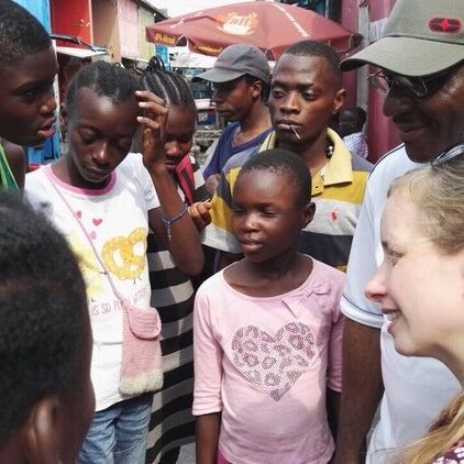 Stephanie chatting with street-living children in Kinshasa (Photo Credit: Feba)